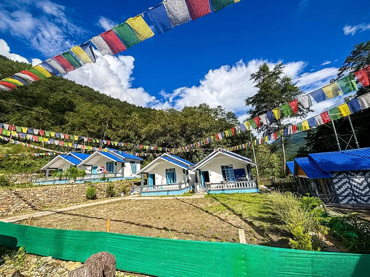 Cottages with prayer flags and garden area